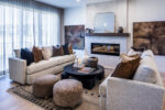 Beautiful living room with electric fireplace and designer mantel